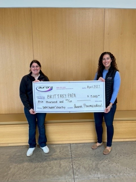 Scholarship recipient Brittany Papa receiving award check