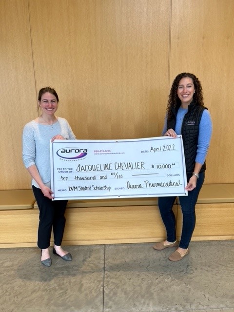 Scholarship recipient Jacqueline Chevalier receiving award check