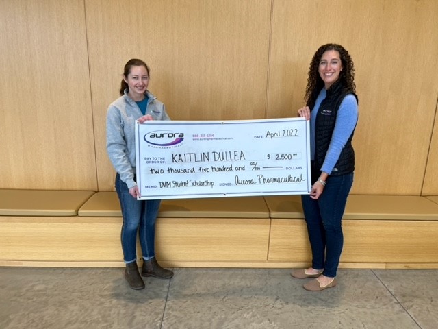 Scholarship recipient Kaitlin Dullea receiving award check