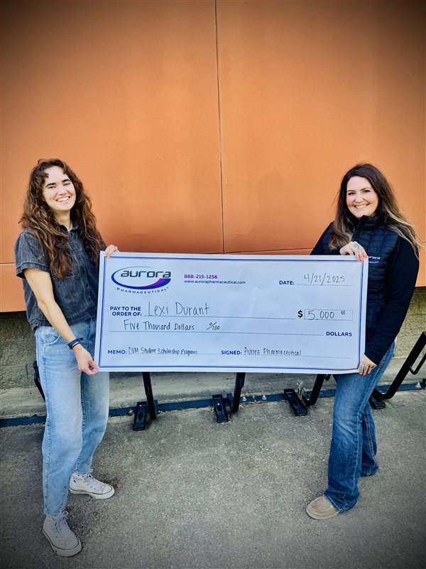 Scholarship recipient Lexi Durant receiving award check