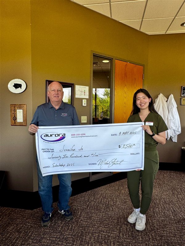 Scholarship recipient Na Youn Jo receiving award check