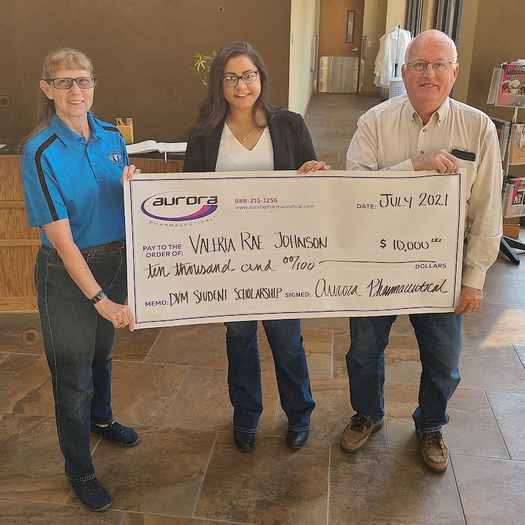 Scholarship recipient Valeria Rae Johnson receiving award check
